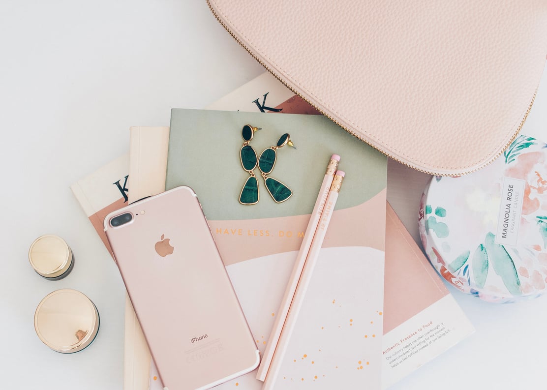 Rose Gold Iphone 7 Plus Beside Pencils on Book